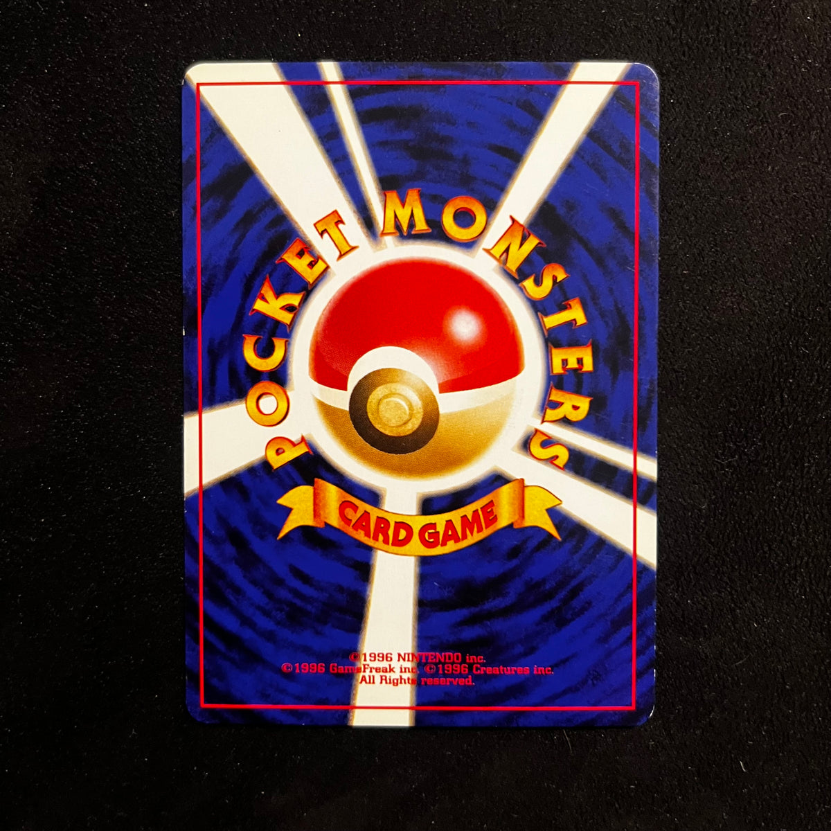 Unown (M) Neo Discovery — Neo Discovery, Japanese Pokémon card in Near Mint condition, image 2